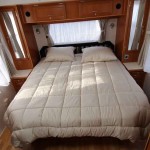 A queen size bed dominates the centre of the bedroom.