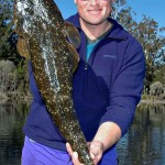Cameron-Whittam-shows-off-a-big-dusky-flathead-caught-in-a-stretch-of-the-Genoa-River-called-Mulligans