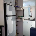 Full height slide out pantry with individual slide out shelves.