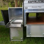 A mesh guard under the frame is a handy place for dirty items or for collecting some firewood along the way