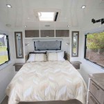 The bedroom is at the front of the van and the queen island bed has good access all round.