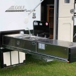 The kitchen runs along the passenger side where a sink with draining board runs back to a Swift 500 Mini Grill with 3+1 burners and a12V rangehood.