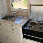 The Swift 500 Series cooker has four burners and grill as well as a Swift stainless steel rangehood and both the stove and stainless steel sink have covers to increase bench space.